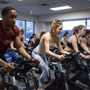Students in an indoor cycling session at Campus Rec's IBC Student Rec Center