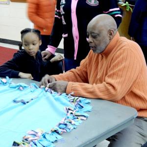 Students, faculty and members of the public make "no sew" blankets for patients at Childrens Hospital of Philadelphia.