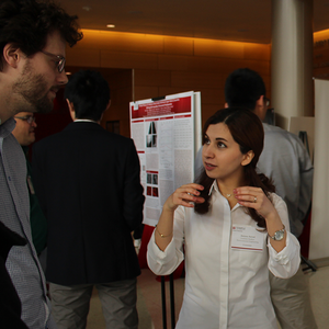 student and faculty discussing research