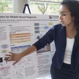 student presenting research