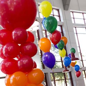 Rainbow balloons hanging in the student center atrium. 