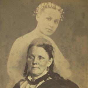 Portrait of a woman with alleged spirit in background