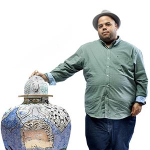 Roberto Lugo with one of his ceramic vessels