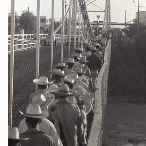 workers crossing a bridge 