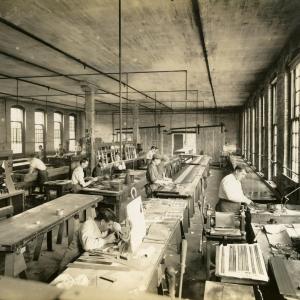 Photograph of workers etching labels onto saws at Disston Saw, Tool and File Works, Philadelphia, Pennsylvania, circa 1920s. United Saw, Files, and Steel Product Workers of America Records, Special Collections Research Center, Temple University Libraries.