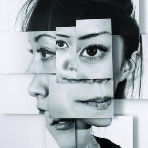 An image of a woman formed into a collage which is meant to represent identity conflict. 