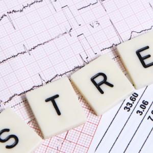 scrabble letters spelling out the word "stress" 