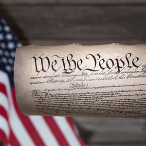 Constitution in front of an American flag