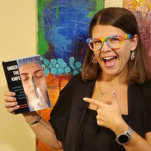 Author posing with book