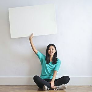 Person holding a poster