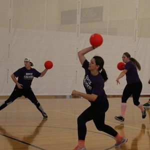 A team of dodgeball players preparing to throw.