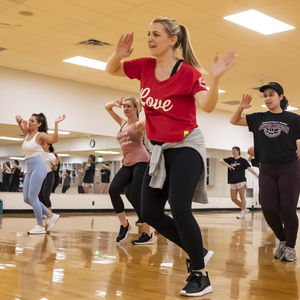 Students in a zumba group fitness session at the IBC Student Rec Center. 